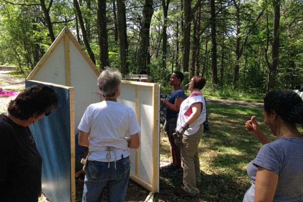 Ife Franklin and her crew installing the Slave Cabin in Franklin Park. It remained in the park for several weeks along with other art installations.
